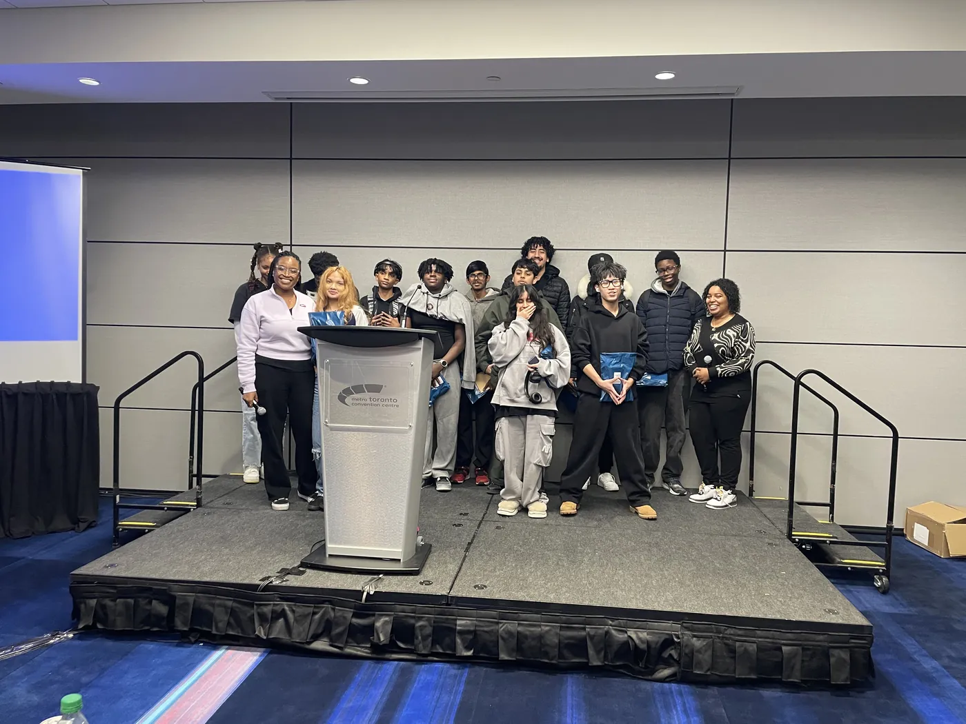 Students on stage at the 2026 AutoShow case study competition