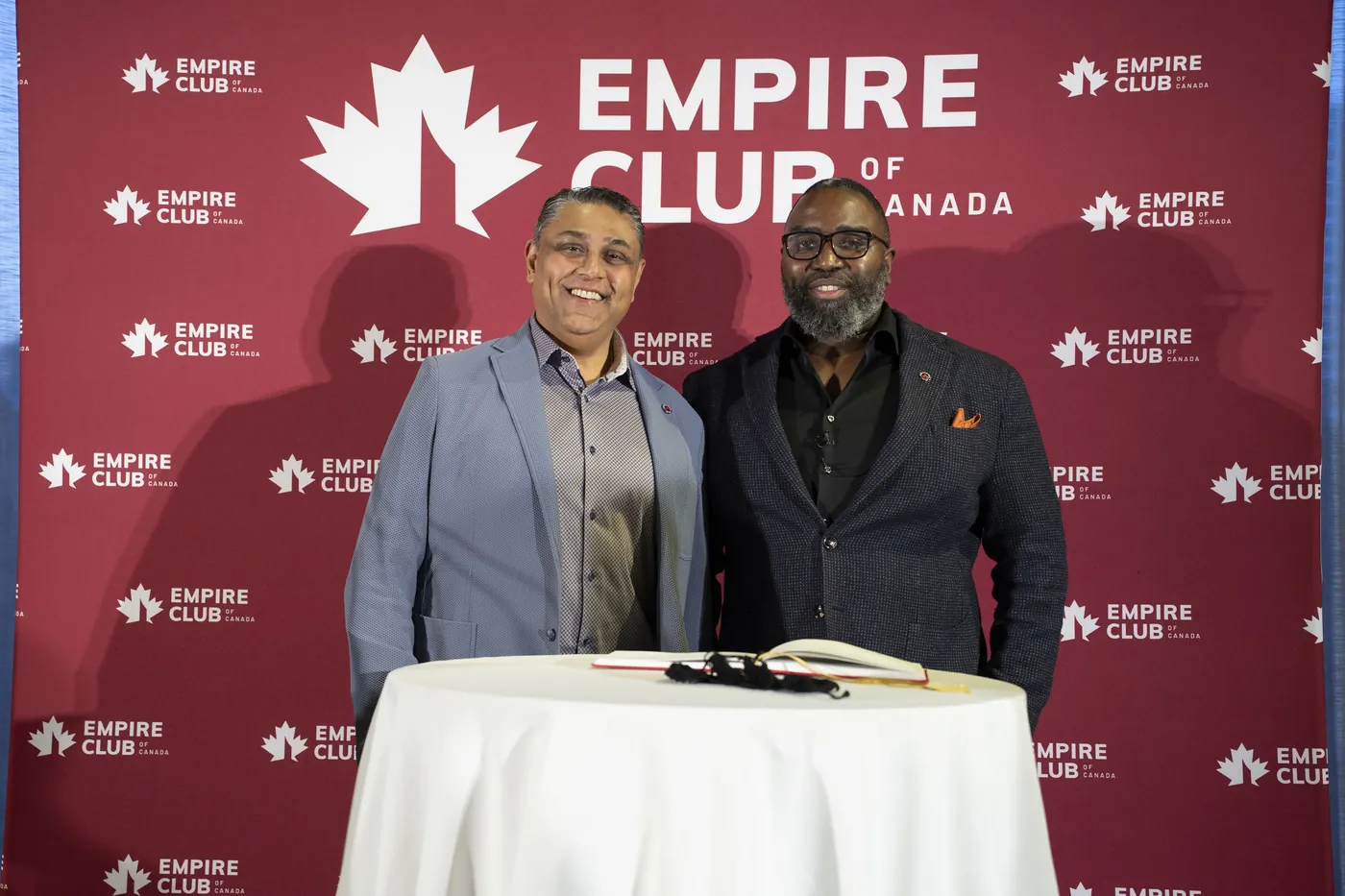 Guests at the Empire Club backdrop