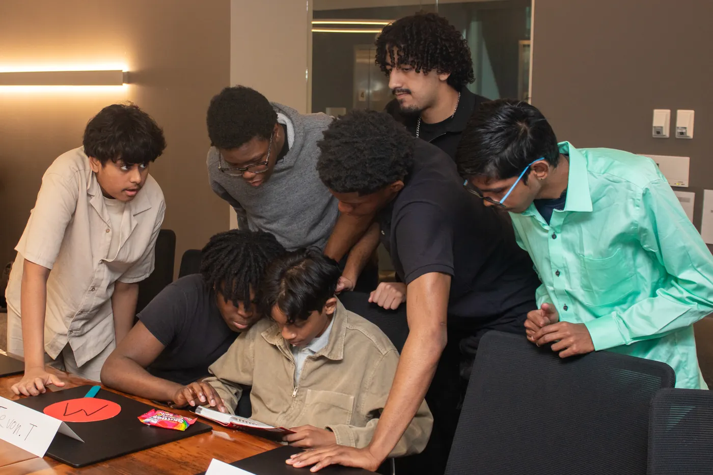 Students working on laptops during Take Our Kids to Work Day at taq