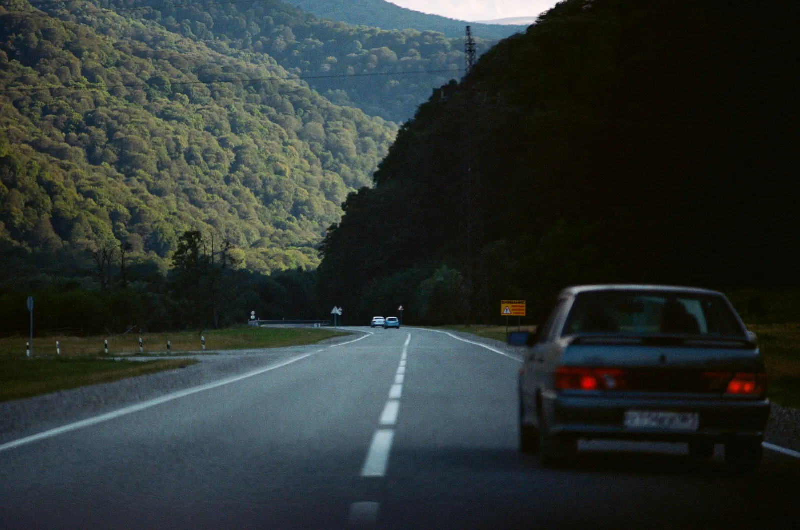 Road winding through a forested valley